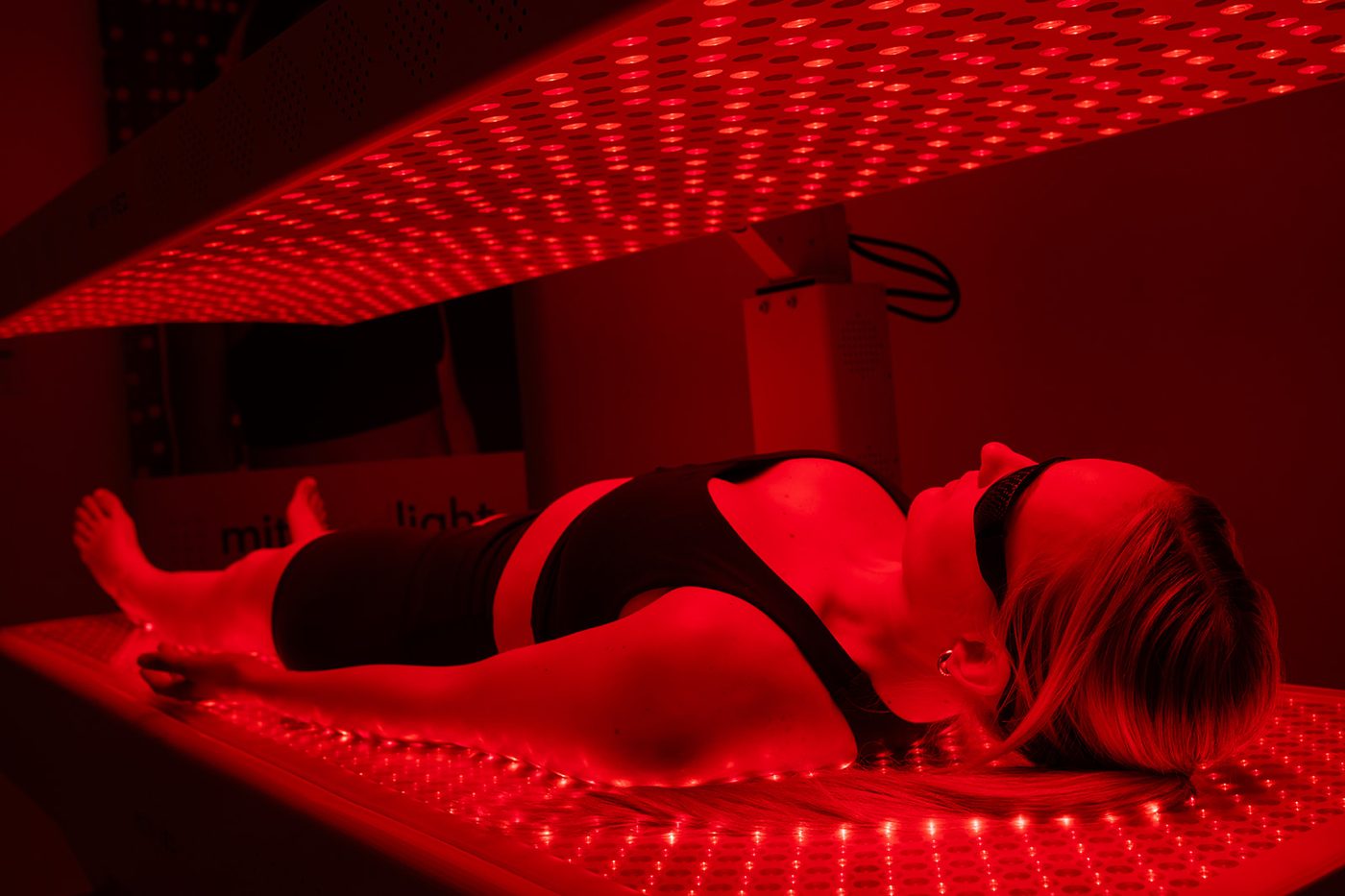 A patient lying down for a red light therapy session at Dr. Augello's practice in Bethlehem